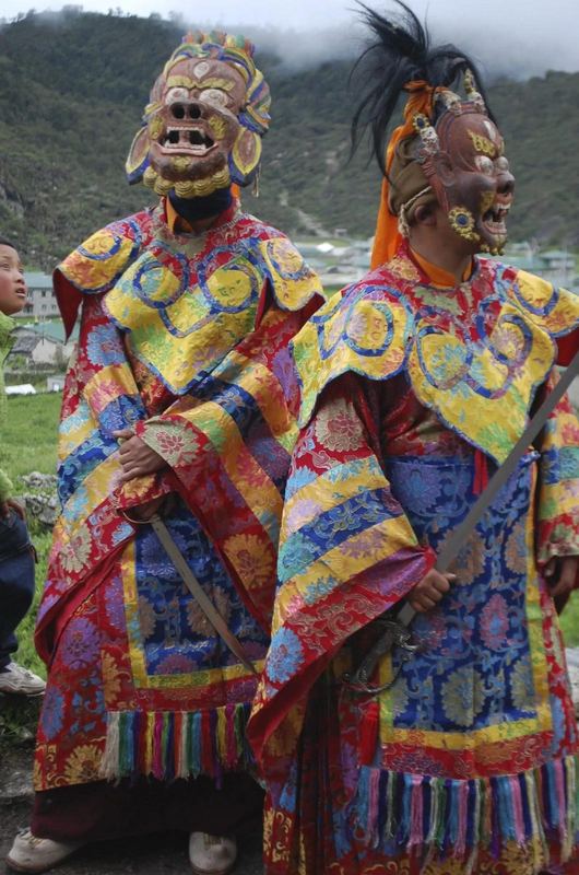 Masked dancers at a monastery festival